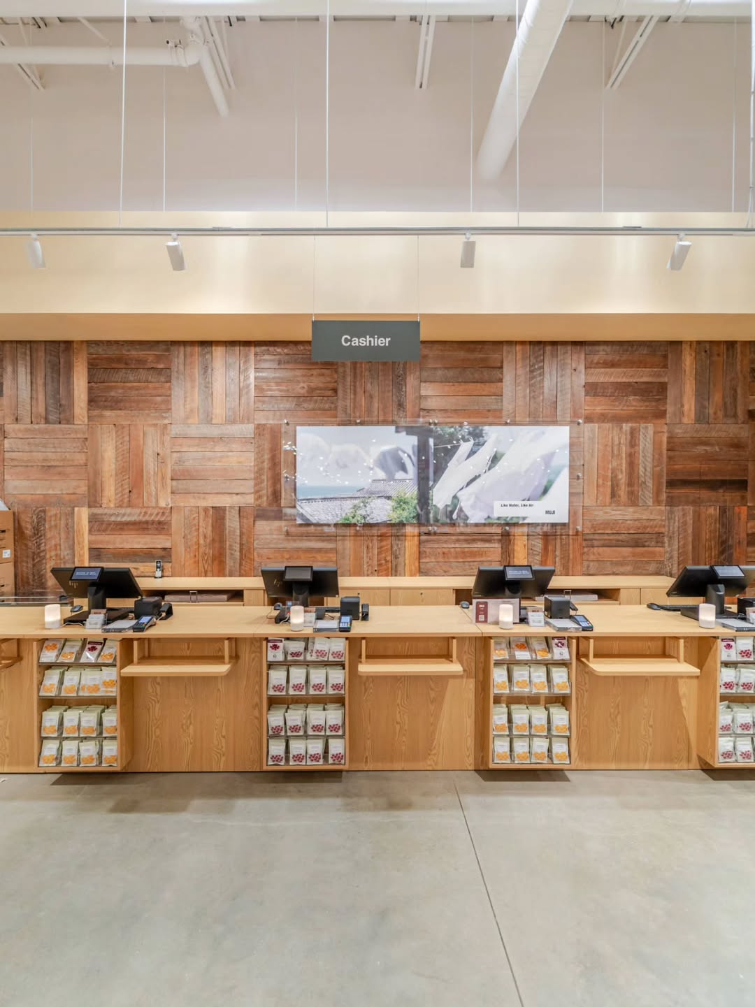The cashier counter in front of a reclaimed wood wall